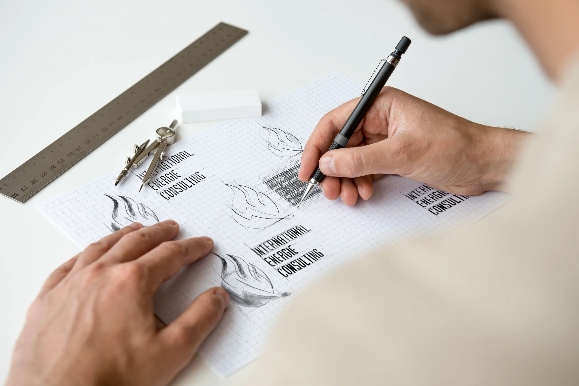 Designer drawing an identity concept on tracing paper